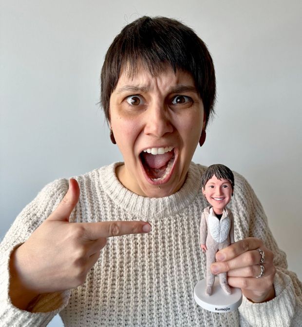 Team member happy showing her bubble head